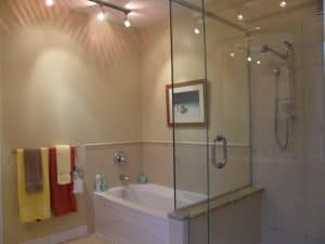 Bathroom renovation with tub and glass shower